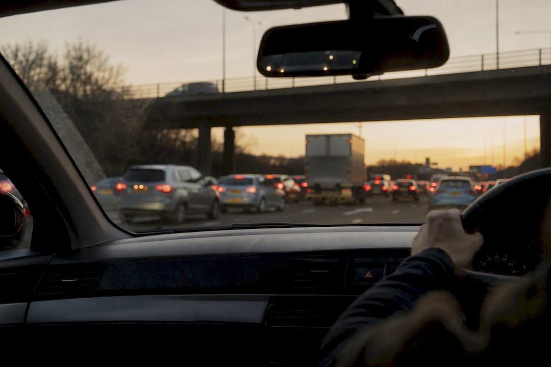 View from car dashboard of heavy highway traffic